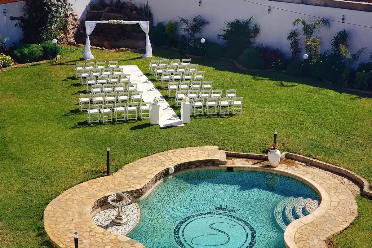 Selborne garden with pool and outdoor wedding ceremony seating